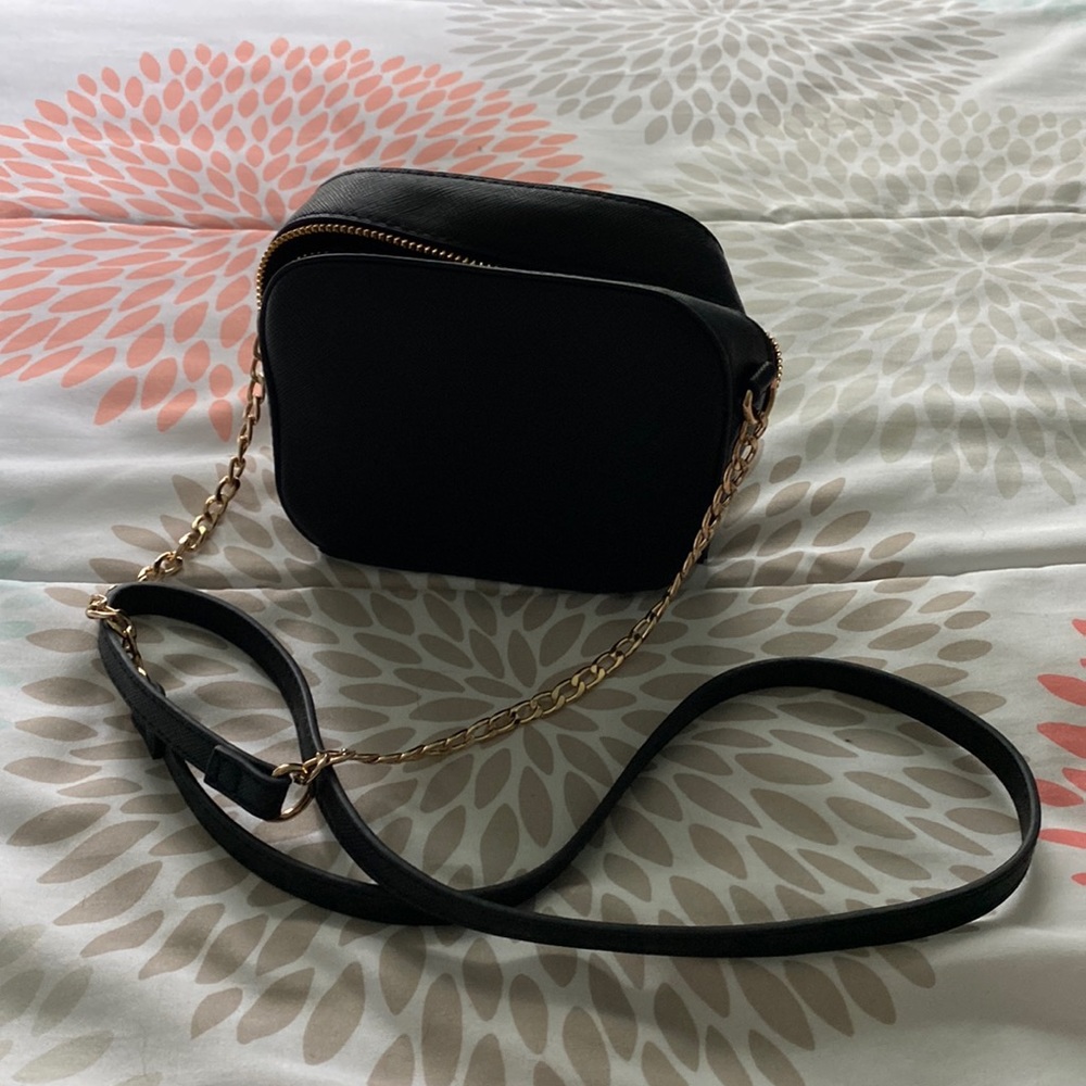 Black small leather bag with gold accents